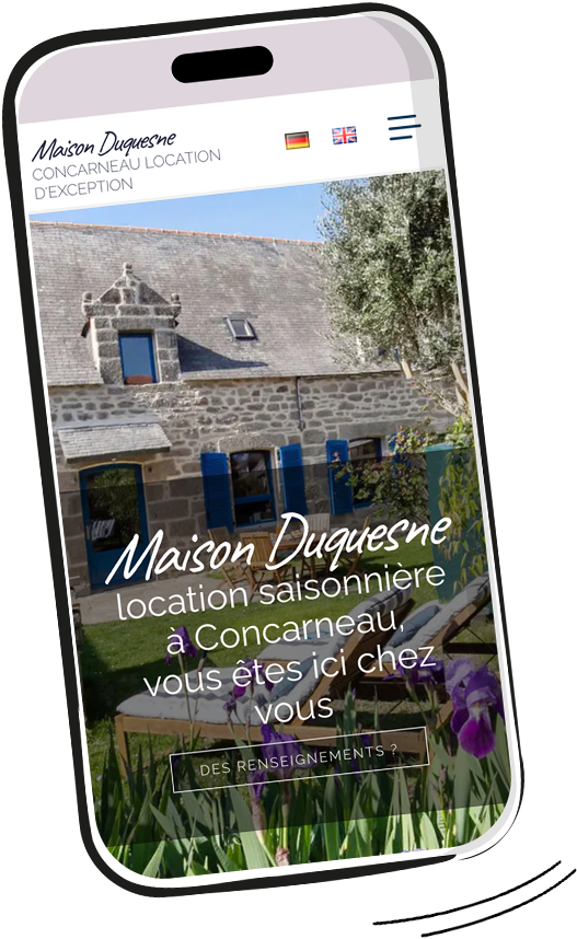 Maison en pierre avec volets bleus, jardin fleuri